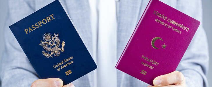 Person holding two passports