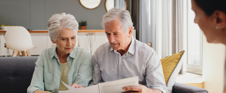 older couple reading over documents