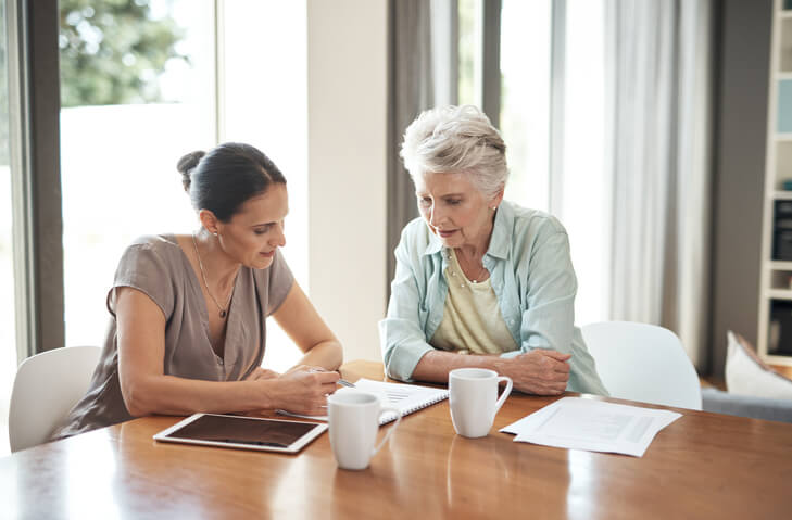 Older woman working with estate planning attorney
