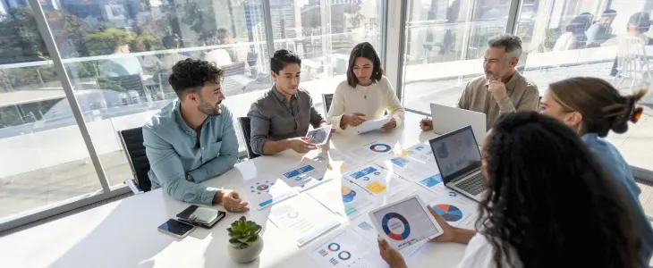 People speaking at a conference table
