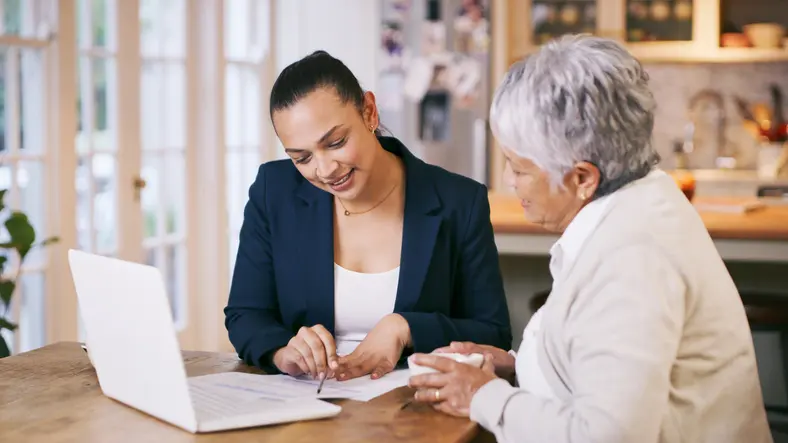 Estate planning attorney sitting with client
