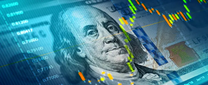100 dollar bill overlayed with digital bar graphs