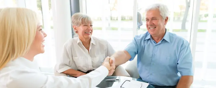 Elderly couple estate planning with lawyer